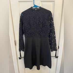 Size 6 Lark & Ro knee length dress. Solid black skirt with floral design on top